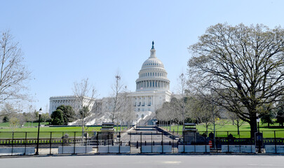 Post January 6, 2021 insurrection barricades and security measures with the Capitol Building in the background.