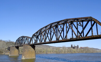 Pinkerton's Landing Bridge stretches across the Monongahela River.  The Carrie Blast Furnaces National Historic Landmark is located in the far distance.