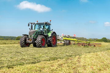 Agricultural machinery during haymaking in the field - 5213