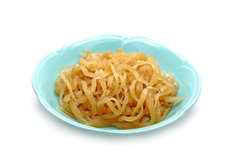 Chinese pickled turnip in ceramic dish isolated on white background