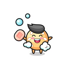 sesame ball character is bathing while holding soap