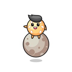 illustration of sesame ball cartoon sitting on the moon