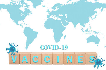Global covid-19 vaccination concept with world map and wooden blocks spelling vaccine.