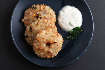 Sabudana vada or Sago fried cake served with peanut chutney , popular fasting recipe from India.
