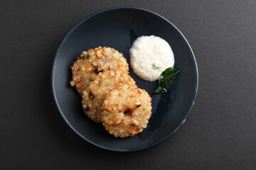 Sabudana vada or Sago fried cake served with peanut chutney , popular fasting recipe from India.

