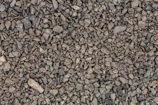 brick rubble debris on construction site. inorganic crushed stone, non-round, loose material with grains. Artificially obtained by crushing coarse-grained rocks and pebbles, accidentally mined