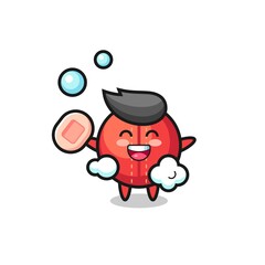 cricket ball character is bathing while holding soap