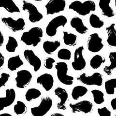 Hand drawn polka dot texture. Seamless black dots pattern with different grunge rounded spots. Vector modern messy ink dry brush strokes on white background. Wallpaper, paper, fabric, textile design.