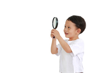Asian little baby boy looking through a magnifying glass to beside isolated on white background