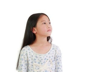 Asian young girl looking up with copy space over white background