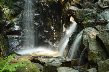 Water flowing down between rocks