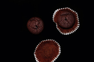 Chocolate muffin on black background