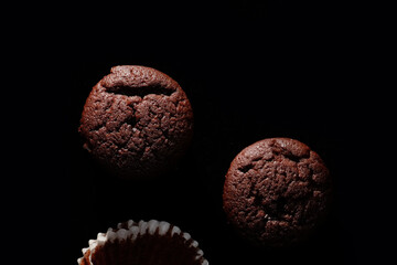 Chocolate muffin on black background