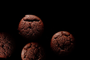 Chocolate muffin on black background