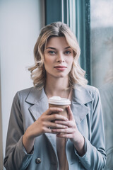 Pretty business blonde woman with coffee