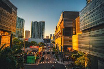 downtown city at sunset reflection sun Brickell miami florida usa sky buildings street road people...