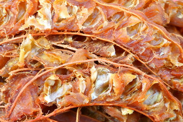 Obraz na płótnie Canvas Close up details of ripe sour brown tamarind pile peeled tamarind seeds for make soggy tamarind