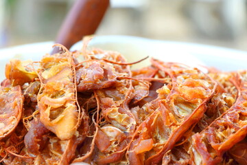 Close up details of ripe sour brown tamarind pile peeled tamarind seeds for make soggy tamarind, side view