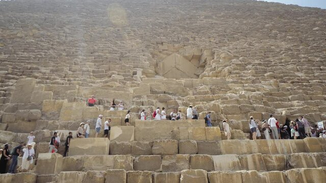 People at the entrance of the Great Pyramid of Giza.