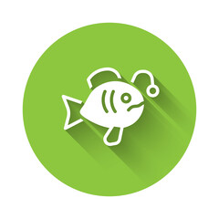 White Tropical fish icon isolated with long shadow. Exotic fish. Green circle button. Vector