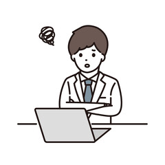 パソコンの前で腕組みをして悩む男性薬剤師