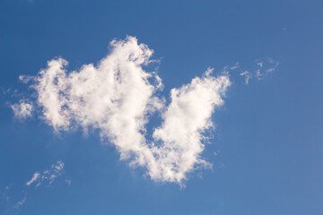 Beautiful blue sky with white cloud. Sky panorama for screensavers, postcards, calendar, presentations. Warm summer day.