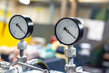 Pressure gauge in the hydraulic control system for powering equipment and machine tools.