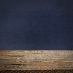 The background is blank wooden boards and a textured plastered wall with lighting and vignetting.