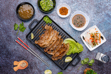 Delicious Grilled Sliced pork belly with barbeque or barbecued sauce plating on plate