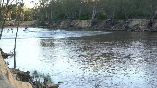 Tubing behind boat on river camping on outback Australia