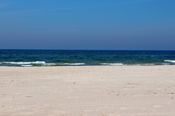Fototapeta na wymiar Warm sea sand on the Baltic Sea beach, Dziwnów, Poland