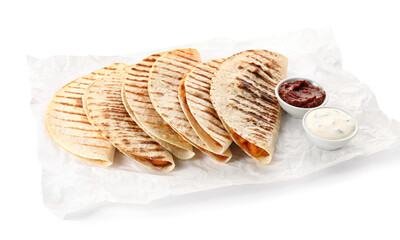 Parchment with tasty quesadillas and sauces on white background