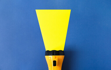 Creative composition with modern flashlight on color background
