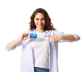 Young woman pointing at vaccination card on white background