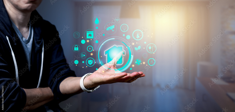 Poster man holding smart home icon as automation assistant on a virtual screen control. panoramic banner of