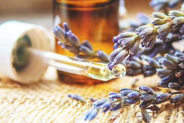 Lavender essential oil in a small bottle.selective focus.