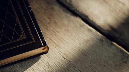 Old books on a wooden table.