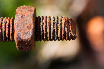 rusty nut. Rusty iron rod with screw threads. Rusted mechanical components. threaded bolt and nut isolated close up. dismantling concept, difficult to unscrew, non-removable. selective focus