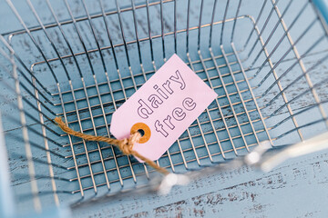 dairy-free product tags with shopping basket, plant-based food or allergies and nutritional choices