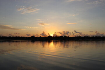 sunset in the swamp reflecting in the river