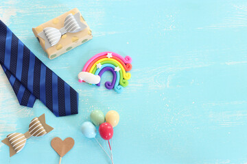 top view image of fathers day composition with vintage father's accessories over blue background