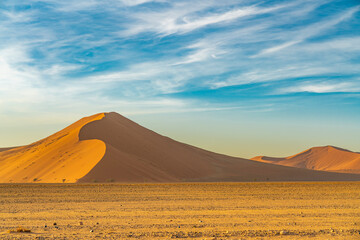 Fototapeta na wymiar Panorama from a big large sand dune during morning time at Sossusvlei