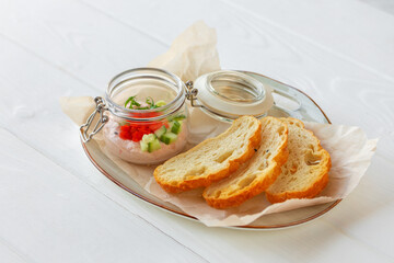 Pieces of bread with fish pate isolated on white