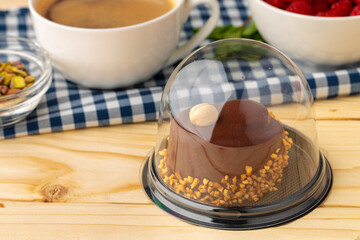 Piece of chocolate cake on table close up