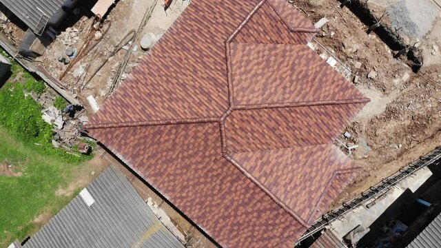 Aerial view cement roof in new house building with motion movement