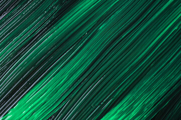Abstract art background dark green and black colors. Watercolor painting on canvas with emerald strokes and splash.