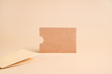 Stylish branding mockup for displaying your artwork, business cards on craft paper. Recyclable material concept, eco-friendly manufacturing. Flat top view. High quality photo