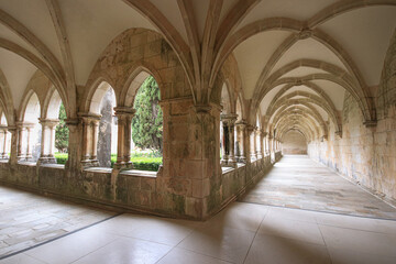 Fototapeta na wymiar Archway of an old monastery. Cloisters of Batalha Monastery
