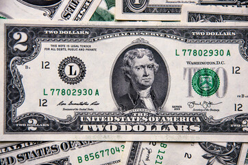 one-and two-dollar bills on a blue background.financial concept