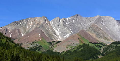 spectacular mountain peaks in summer along route 40 in the peter loughwood provincial park enroute to banff national park, alberta, canada